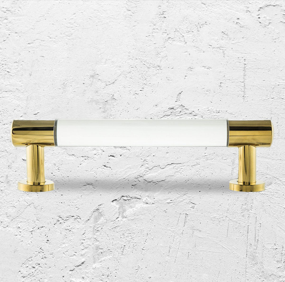 Round brass bar pull with Lucite accent piece in the center of the handle.