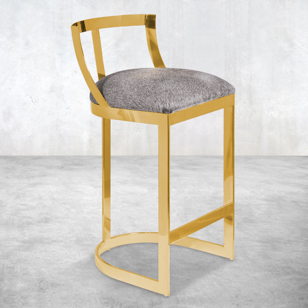 Polished brass bar counter stools with an open, brass framed back, a U-shape rounded base and plush gray upholstered seat.