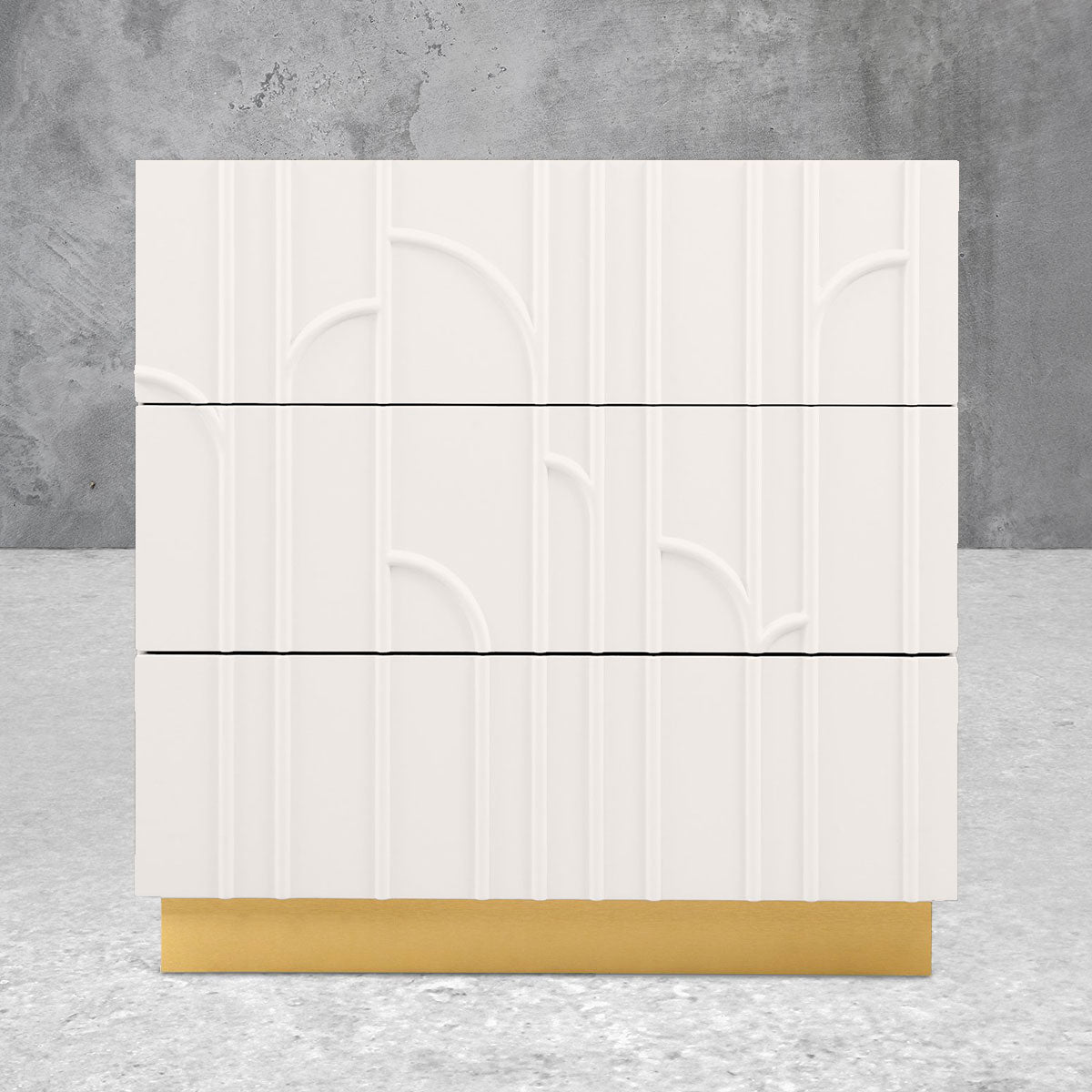 Three-door side table with a decorative white facade and brass pedestal base.